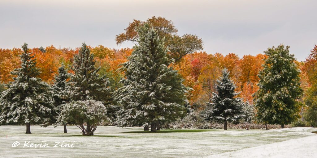 Snow over the fall colors in Iron County Michigan