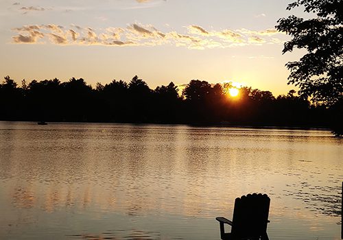 Lakeshore-Motel-Ice-Lake-sun-over-water