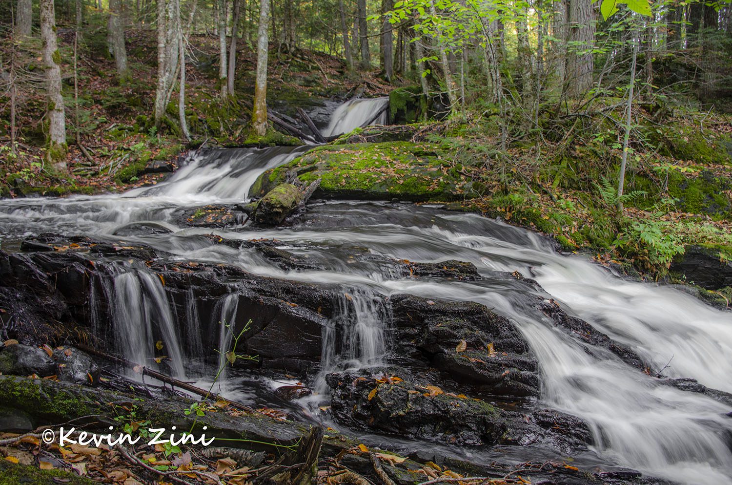 Duppy Falls cascading over dark rock ledges on the Jumbo River, with the first fallen leaves