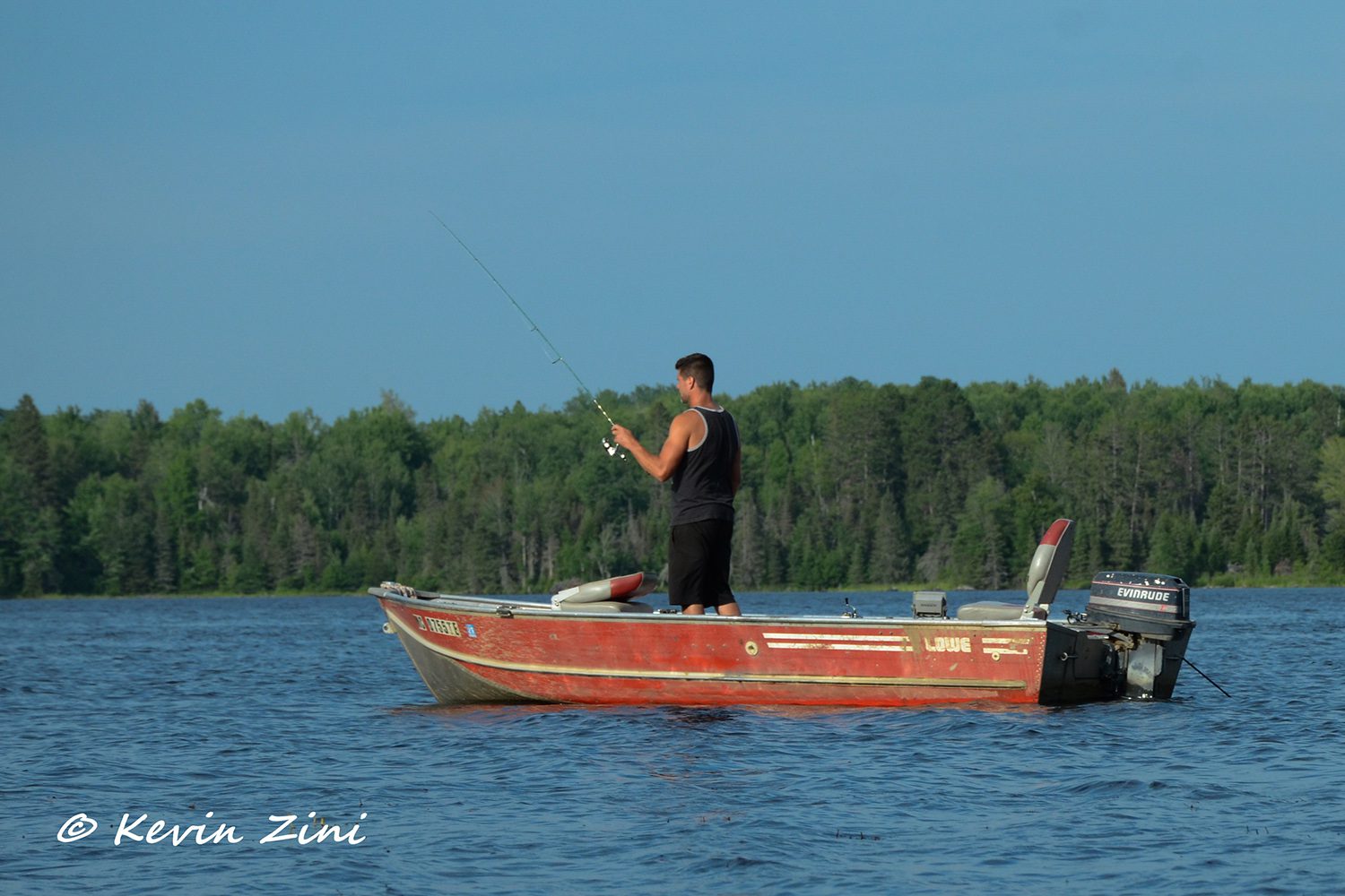 guy fishing in a boat