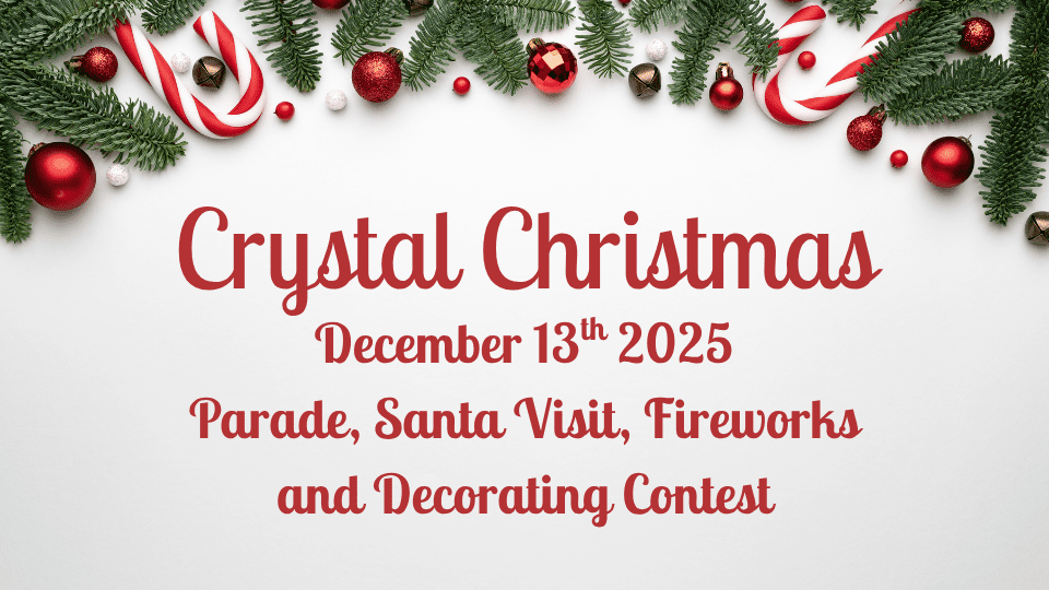 Holiday parade floats and Christmas lights during A Crystal Christmas in downtown Crystal Falls, Michigan.