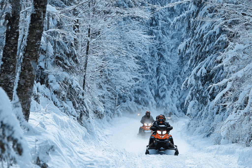Snowmobiles on groomed trails in Iron County, Michigan.