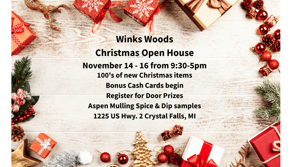 Flat lay of wrapped Christmas gifts, pine branches, and festive decorations promoting the Winks Woods Christmas Open House in Crystal Falls, Michigan.