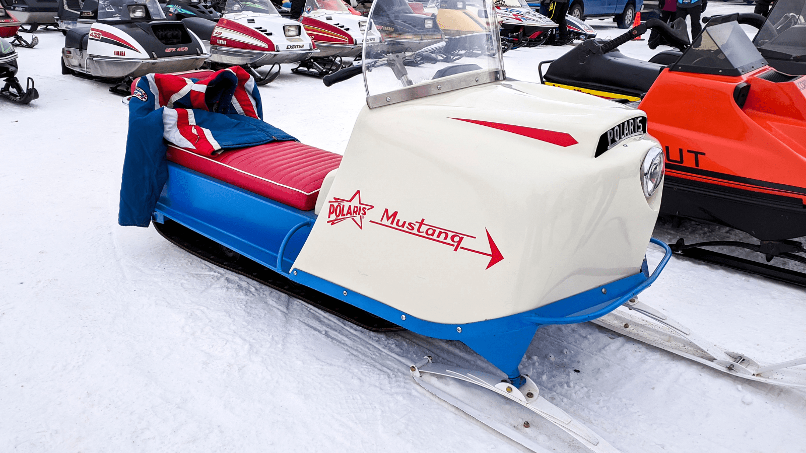 antique red white and blue polaris snowmobile